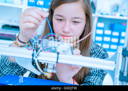 Female Architect Using 3D Printer Stock Photo