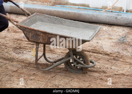 wet cement in the cart for pouring Stock Photo