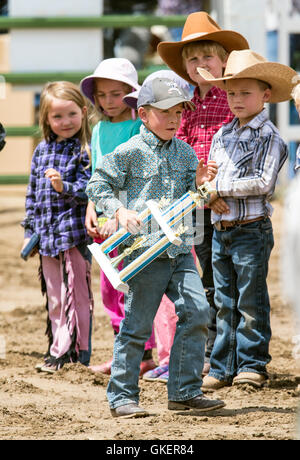 Winning Mutton Bustin' children line up for awards; Chaffee County Fair & Rodeo, Salida, Colorado, USA Stock Photo