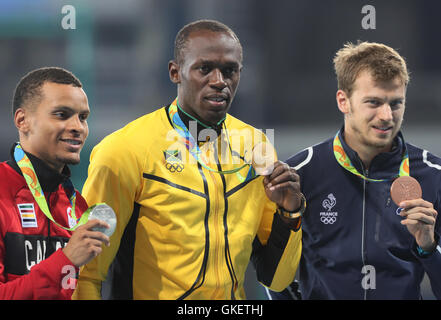 (From left to right) Silver medallist Canada's Andre De Grasse, gold medallist Jamaica's Usain Bolt and bronze medallist France's Christophe Lemaitre for the Men's 200m Final at Olympic Stadium on the fourteenth day of the Rio Olympic Games, Brazil. Stock Photo