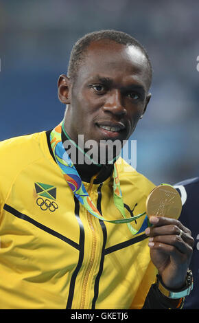 Jamaica's Usain Bolt with his gold medal for the Men's 200m Final at Olympic Stadium on the fourteenth day of the Rio Olympic Games, Brazil. Stock Photo