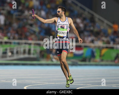 Great Britain's Martyn Rooney celebrates winning the Men's 4 x 400m Relay Round 1 - Heat 2 before Great Britain are disqualified at Olympic Stadium on the fourteenth day of the Rio Olympic Games, Brazil. Stock Photo