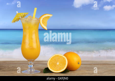 oranges fruit juice cocktail on the beach Stock Photo