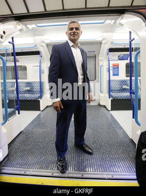 Mayor of London Sadiq Khan poses for the media on a Victoria line tube train carriage at Brixton Underground station, during the launch of London's Night Tube, as trains will operate overnight on Fridays and Saturdays on the Victoria line and parts of the Central line, with the Jubilee, Northern and Piccadilly lines following in the autumn. Stock Photo