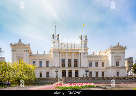 Students resting in the park in front of Lund university Stock Photo