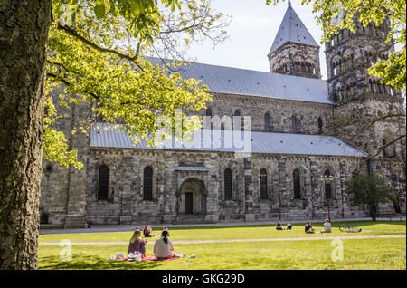 Students picnic in the park in front of Lund cathedral, Sweden Stock Photo