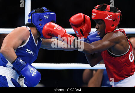 Rio De Janeiro, Brazil. 20th Aug, 2016. Britain's Nicola Adams (R) competes against France's Sarah Ourahmoune during the women's fly (48-51kg) final bout of Boxing at the 2016 Rio Olympic Games in Rio de Janeiro, Brazil, on Aug. 20, 2016. Nicola Adams won the gold medal. Credit:  Lin Yiguang/Xinhua/Alamy Live News Stock Photo