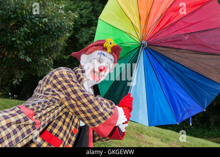 Southport, Merseyside. UK Weather: 20th August  2016.Weather:  As the high winds and gales hit resort, Sonny & Rainbow struggle to hold on to their umbrellas.  As two of the funniest clowns around, Gordon Murray and Gary McBeth,  can turn everyday situations into funny scenarios.  The crowds were blown away by their antics as the bad weather struck once again over the crowds at the Southport Flower Show.  Credit:  Cernan Elias/Alamy Live News Stock Photo