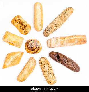 various freshly baked buns and loaves in sun shape on white background Stock Photo