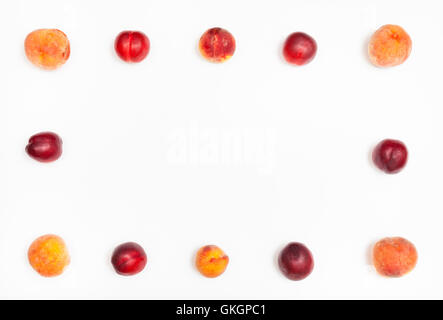 frame from ripe nectarines and peaches on white background Stock Photo