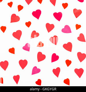 pink and red hearts cutout from color paper on white square background Stock Photo