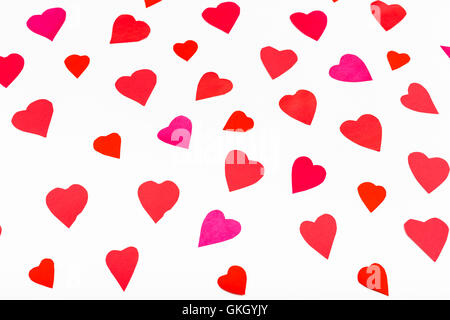 pink and red hearts cut out from paper on white background Stock Photo