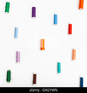 several spools of sewing thread on white background Stock Photo