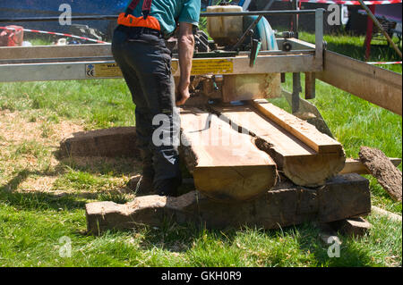 Contractor using mobile saw mill at Llanthony Show, near Abergavenny, Monmouthshire, South Wales, UK Stock Photo