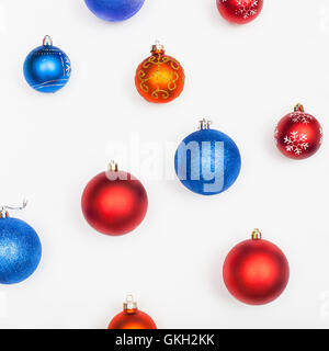 several blue, red, orange christmas balls on white background Stock Photo