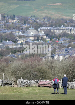 Senior Caucasian Couple Admiring the View of Buxton Town from Buxton Country Park, Derbyshire, England, UK Stock Photo