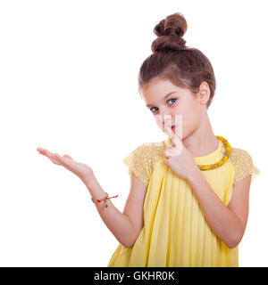 Beautiful youth little girl presenting copy space, studio on white background Stock Photo