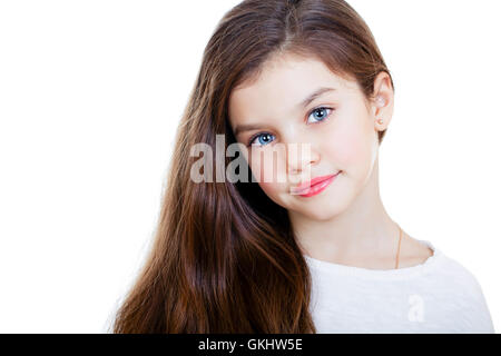 Portrait of a charming little girl smiling at camera, isolated on white background Stock Photo