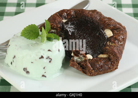 triple chocolate cake with mint and choc chip ice cream Stock Photo