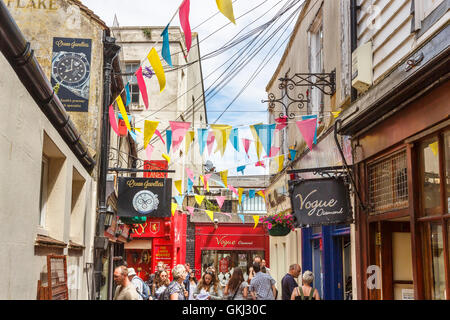 Shop signs and colourful bunting in The Lanes, Brighton, East Sussex, UK on a sunny summer day Stock Photo