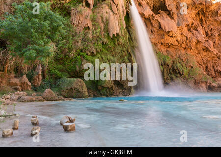 Stumps for sitting in the pool below Havasu Falls on the Havasupai Indian Reservation in the Grand Canyon. Stock Photo