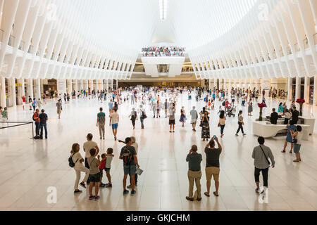 Shoppers and tourists enjoy the view inside the Oculus and stores in the Westfield World Trade Center mall in New York City. Stock Photo