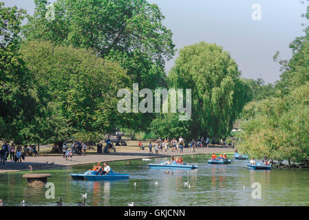 Regent's Park London, view of people enjoying a summer afternoon on the boating lake in Regent's Park, London, UK. Stock Photo