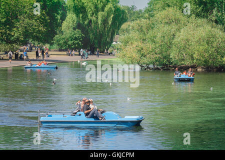 Boating lake London summer, tourists enjoy a summer afternoon on the boating lake in Regent's Park, London, UK. Stock Photo