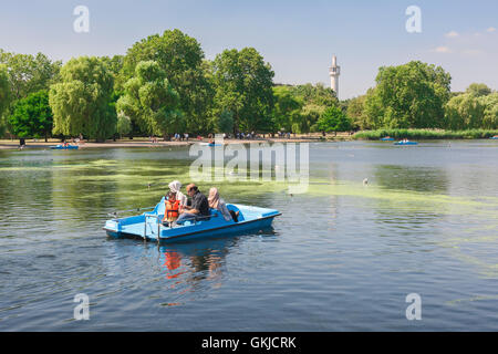 Regent's Park Lake, view of tourists enjoying a summer afternoon on the boating lake in Regent's Park, London, UK. Stock Photo