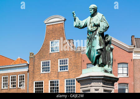 Statue of Laurens Janszoon Coster and bell gable of old house on Grote Markt market square in downtown Haarlem, Netherlands Stock Photo