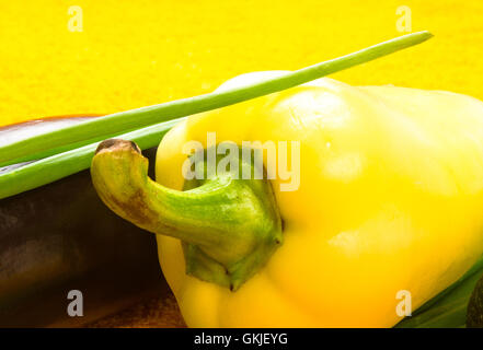 Bright yellow zucchini and green cucumber. Penis size concept in