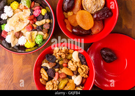 various dried fruits, mixed nuts and walnuts on the wooden background Stock Photo