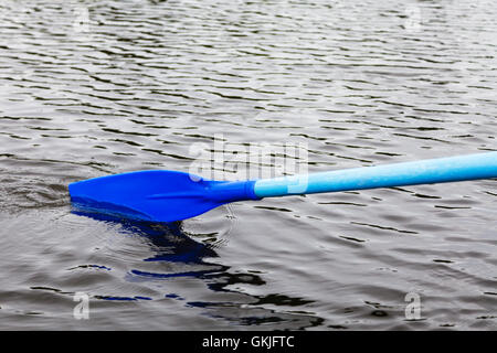oar blade in water during boating on the pond Stock Photo