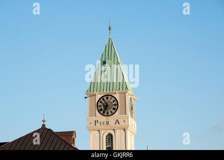 The Pier A clock tower was installed in 1919 as the first United States memorial to U.S. servicemen who died in World War I. Stock Photo