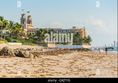 Senior couple jogging on a nearly empty beach near The Breakers resort hotel in Palm Beach, Florida. (USA) Stock Photo