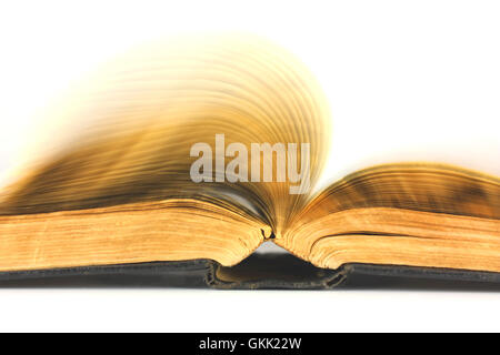 Old book flipping on a white background Stock Photo