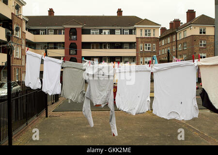 washing hanging from line in play area of dublin social housing oliver bond flats in the liberties dublin city centre Ireland Stock Photo