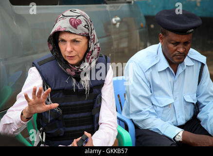 SOMALIA, Baidoa: In a photograph taken and released by the African Union-United Nations Information Support Team 20 October 2013, Joanna Reid, head of UK Department of Foreign and International Development (DFID) in Somalia gestures during a meeting with Somali police and members of the African Union Mission in Somalia (AMISOM) in the central Somali town of Baidoa. Reid was visiting the capital of Somalia's Bay and Bakool Region to see first-hand the impact and progress of UK-funded projects to renovate the central police station, a similar forthcoming project to repair and improve the town's  Stock Photo