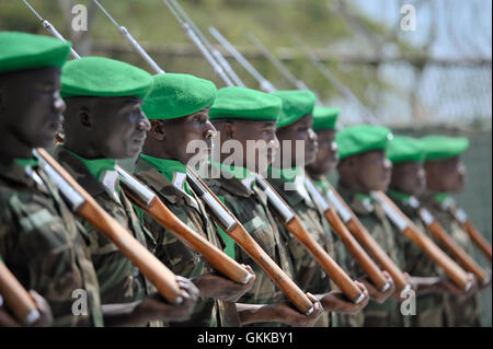 African Union soldiers hold a guard of honor as AMISOM's new Force Commander, General Silas Ntigurirwa, today took over command of the African Union Mission in Somalia on December 16. Stock Photo