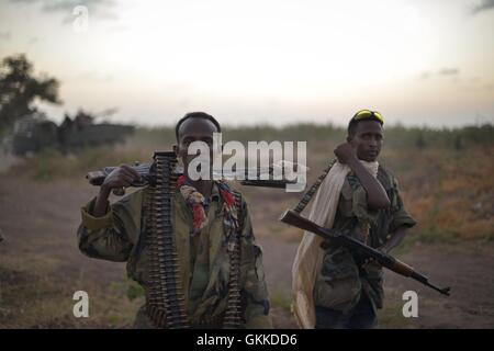 Somali National Army soldiers stand with their weapons at the ready on March 21 at a base in Janaale, Somalia, ahead of a planned offensive by both the SNA and the African Union Mission in Somalia on the nearby town of Qoryooley. AU UN IST PHOTO / Tobin Jones Stock Photo