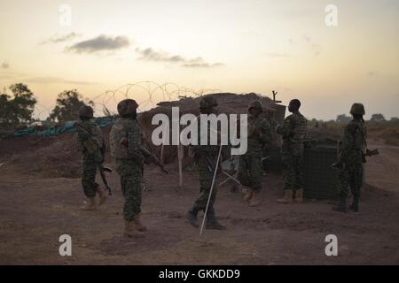 Ugandan soldiers, belonging to the African Union Mission in Somalia, stand at an AU base in Janaale, Somalia, on March 21 ahead of a offensive currently being planned on the nearby town of Qoryooley. AU UN IST PHOTO / Tobin Jones Stock Photo