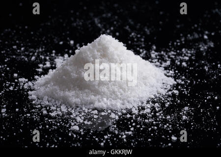 Heap of coarse salt on black background Stock Photo