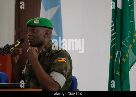 SOMALIA, Mogadishu: In a photgraph released by the African Union-United Nations Information Support Team, outgoing African Union Mission in Somalia (AMISOM) spokesperson Lt. Col. Paddy Ankunda, gestures during a press breifing to introduce his successor, Colonel Ali Aden Houmed of the Djiboutian Armed Forces (not pictured) 07 July, at the mission's headquarters in the Somali capital Mogadishu. Colonel Ali replaces Lt. Col. Ankunda who has been AMISOM spokesperson since April 2011, as AMISOM expands its areas of operation outside Mogadishu with new sector headquarters now in Baidoa, Beletweyne  Stock Photo