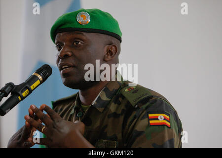 SOMALIA, Mogadishu: In a photgraph released by the African Union-United Nations Information Support Team, outgoing African Union Mission in Somalia (AMISOM) spokesperson Lt. Col. Paddy Ankunda, gestures during a press breifing to introduce his successor, Colonel Ali Aden Houmed of the Djiboutian Armed Forces (not pictured) 07 July, at the mission's headquarters in the Somali capital Mogadishu. Colonel Ali replaces Lt. Col. Ankunda who has been AMISOM spokesperson since April 2011, as AMISOM expands its areas of operation outside Mogadishu with new sector headquarters now in Baidoa, Beletweyne  Stock Photo