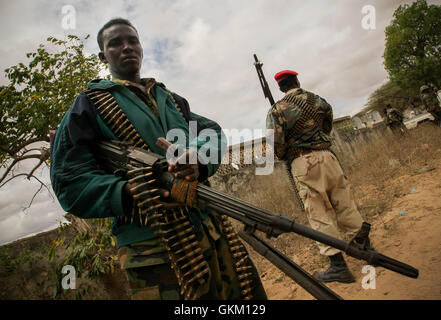 SOMALIA, Balad: In a photograph taken 01 August and released by the African Union-United Nations Information Support team 02 August, Somali soldiers stand guard during a visit by President Sheik Sharif Sheik Ahmed to Balad town in Middle Shabelle region approx. 40km north east of the capital Mogadishu. Balad was until recently, under the control of the Al-Qaeda-affliated terrorist group Al Shabaab until an offensive by the Somali National Army (SNA) supported by the African Union Mission in Somalia (AMISOM) forces on 26 June drove out the extremists, liberating the town and its people, and bri Stock Photo