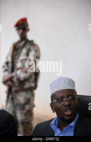 SOMALIA, Balad: In a photograph taken 01 August and released by the African Union-United Nations Information Support team 02 August, Somali President Sheik Sharif Sheik Ahmed reacts during a meeting with traditional elders and leaders in Balad town, Middle Shabelle region approx. 40km north east of the capital Mogadishu. Balad was until recently, under the control of the Al-Qaeda-affliated terrorist group Al Shabaab until an offensive by the Somali National Army (SNA) supported by the African Union Mission in Somalia (AMISOM) forces on 26 June drove out the extremists, liberating the town and  Stock Photo