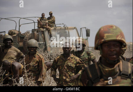 SOMALIA. Saa'moja / Kisamayo: In a handout photograph released by the African Union-United Nations Information Support Team 01 October, soldiers of the Kenyan Contingent serving with the African Union Mission in Somalia (AMISOM) stand in Saa'moja, an area approx. 7km outside the Somali port city of Kismayo. For the last two months, AMISOM's Kenyan Contingent in support of the Somali National Army (SNA) has been steadily liberating areas and villages in Southern Somalia formally under the control of the Al Qaeda-affiliated extremist group Al Shabaab, which has brought them to the outskirt's of  Stock Photo