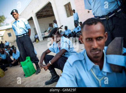 SOMALIA, Mogadishu: In a handout photograph dated 17 January and released by the African Union-United Nations Information Support Team 18 January, members of the Somali Police Force (SPF) gather ahead of their departure from Aden Abdulle International Airport in the Somali capital Mogadishu for a three-month training course in Djibouti organized by the Police component of the African Union Mission in Somalia in conjunction with the Italian Carabineri. The 184 Men and 16 women will receive specialized training in Public Order Management facilitated by AMISOM with funding support from the Italia Stock Photo