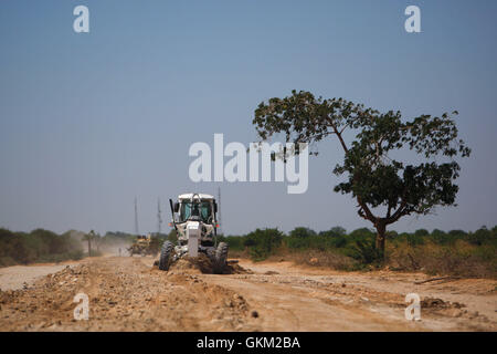 SOMALIA, Mogadishu: In a photgraph taken 24 January and released by the African Union-United Nations Information Support Team 26 January, African Union Mission in Somalia (AMISOM) combat engineers grade and repair a stretch of road leading to the town of Afgooye in Somalia's Lower Shabelle region along the main route linking the fertile, agricultural region with the capital Mogadishu. After years under the control of the violent extremist Al-Qaeda linked group Al Shabaab, stretches of the economically  important thoroughfare were virtually in-passable. Now, 7 months after the Shabaab were forc Stock Photo