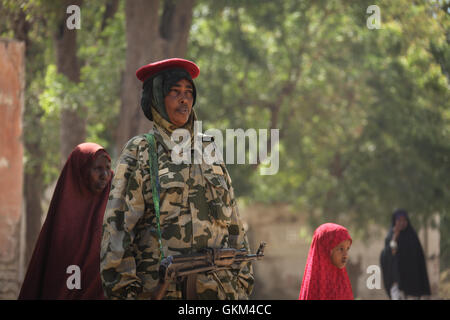 A female member of the Somali National Army guards a checkpoint at Lama Galay Military Training Camp in Belet Weyne, Somalia, on Sept. 8. AU UN IST PHOTO / Ilyas A. Abukar Stock Photo